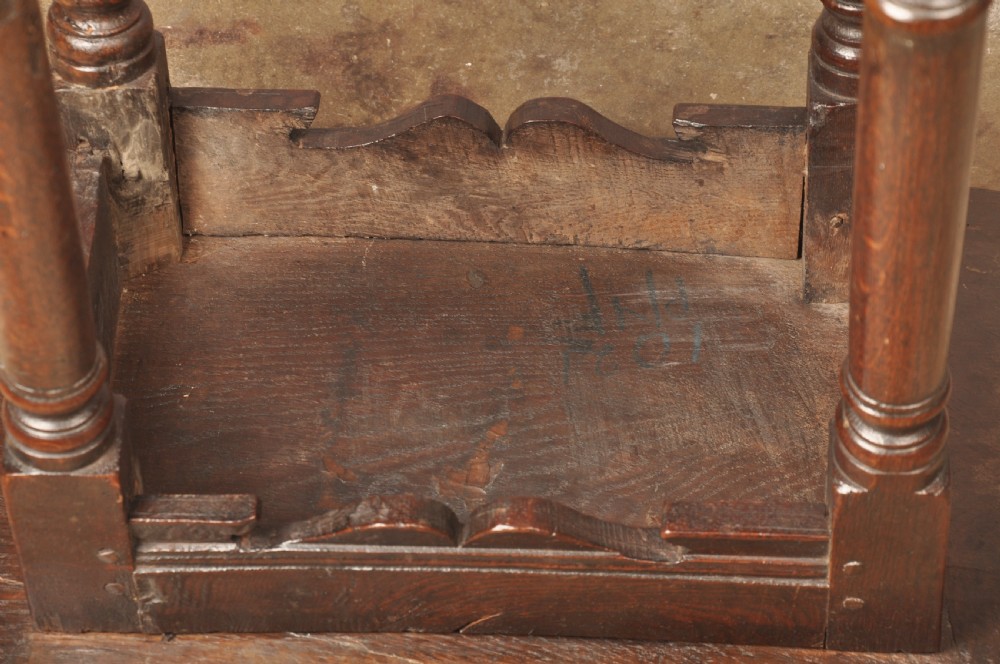 A mid-17th-century solid oak joint stool featuring turned legs, a rectangular top, and lower perimeter stretchers. View XIII