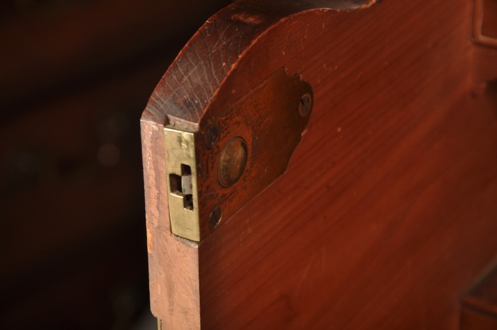 An 18th-century mahogany secretaire bookcase featuring a dentil cornice, astragal-glazed upper cabinet doors, a drop-front writing drawer with brass handles, and a two-door lower cupboard resting on bracket feet. View VIII