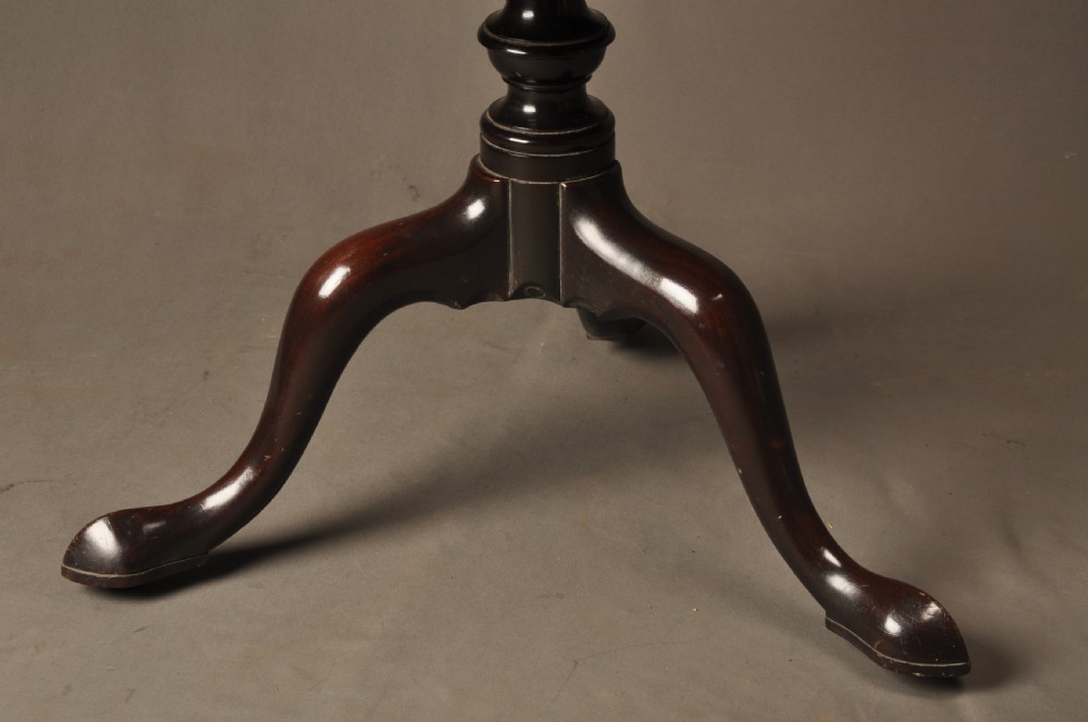 An 18th-century mahogany three-tiered dumb waiter featuring graduated dished trays, a turned central column, and tripod cabriole legs. View II
