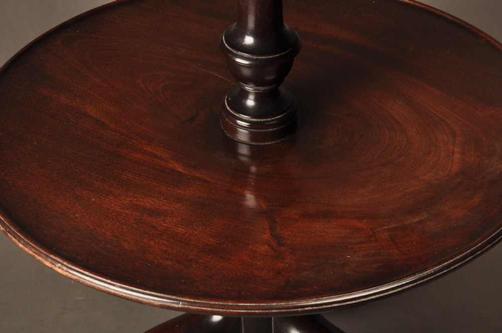 An 18th-century mahogany three-tiered dumb waiter featuring graduated dished trays, a turned central column, and tripod cabriole legs. View III