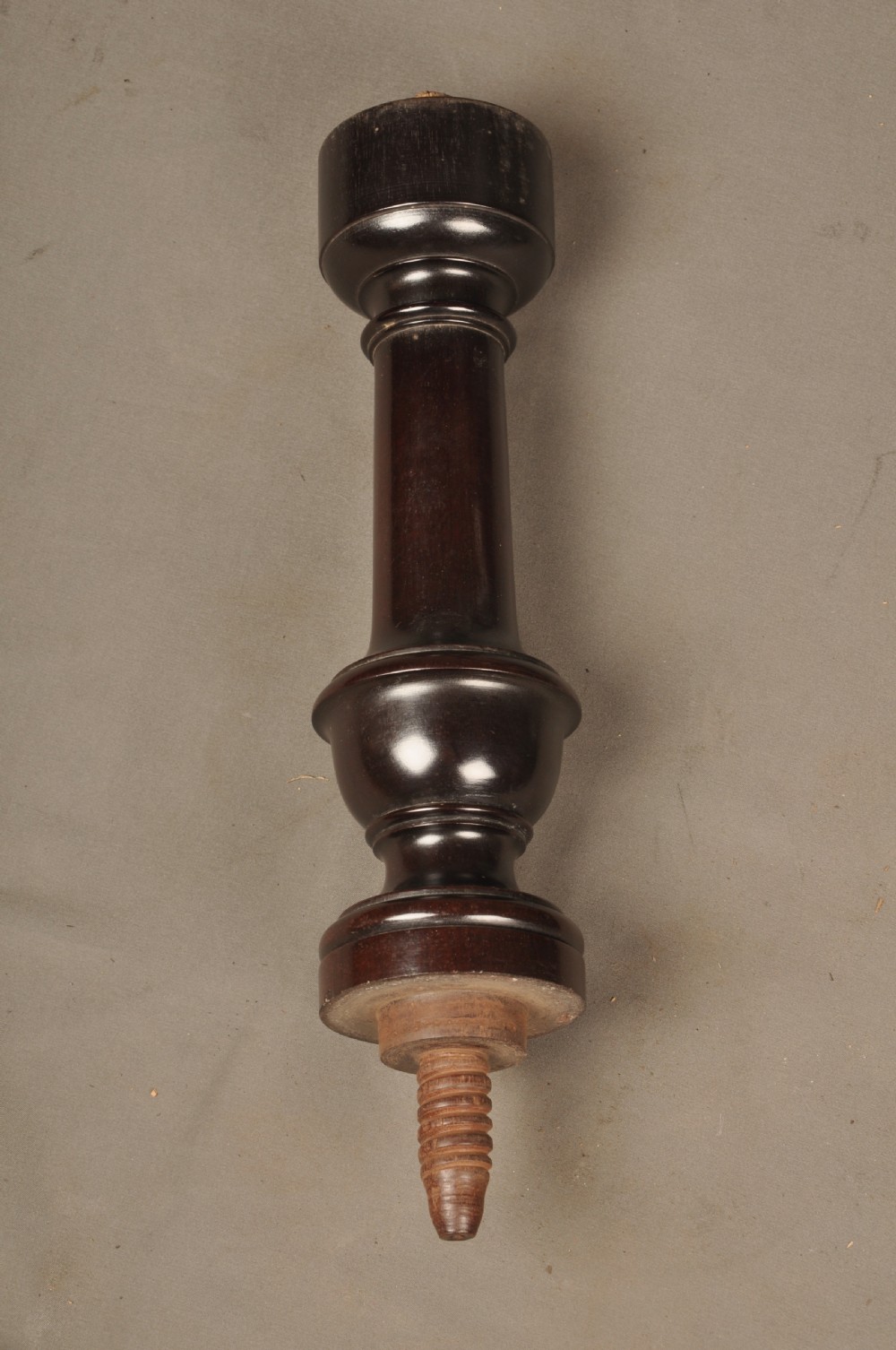 An 18th-century mahogany three-tiered dumb waiter featuring graduated dished trays, a turned central column, and tripod cabriole legs. View XI