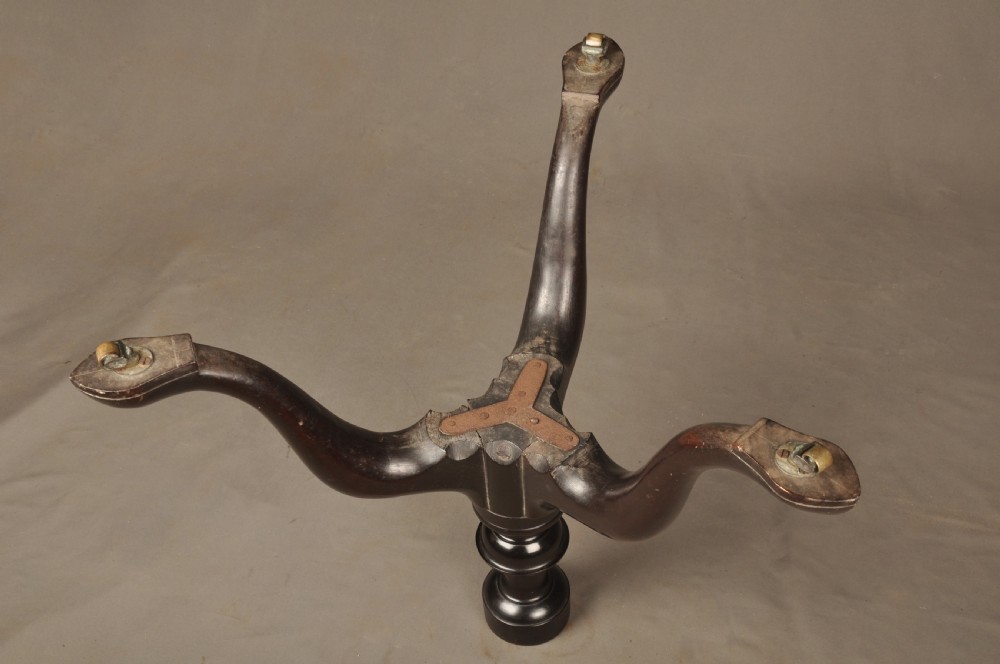 An 18th-century mahogany three-tiered dumb waiter featuring graduated dished trays, a turned central column, and tripod cabriole legs. View XII