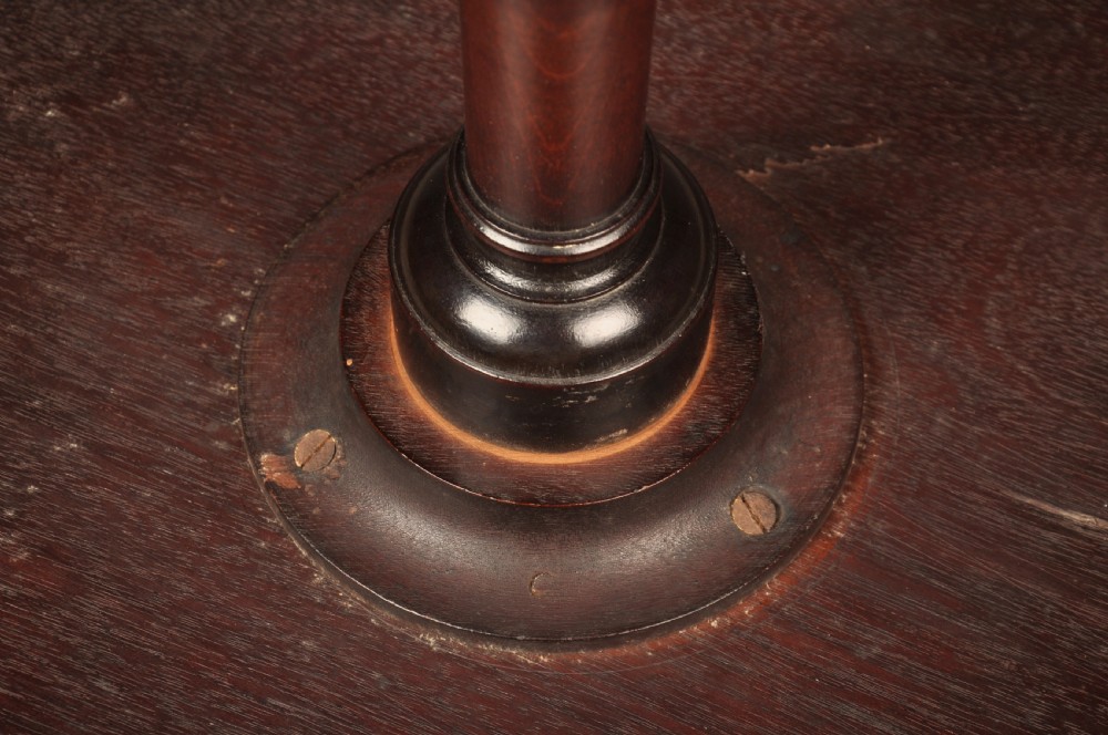 An 18th-century mahogany three-tiered dumb waiter featuring graduated dished trays, a turned central column, and tripod cabriole legs. View XIV