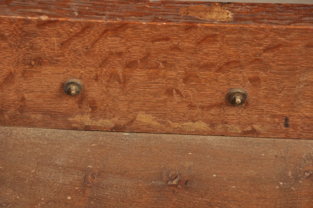 A mid-18th-century warm brown oak slant-front writing bureau featuring four graduated drawers with brass swan-neck handles and bracket feet. View VIII
