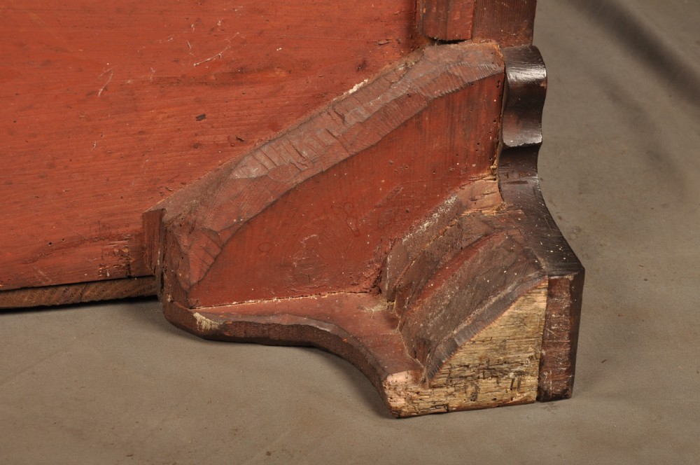 An 18th-century Georgian mahogany serpentine chest of drawers featuring four graduated drawers, brass swan-neck handles, and bracket feet. View XIV