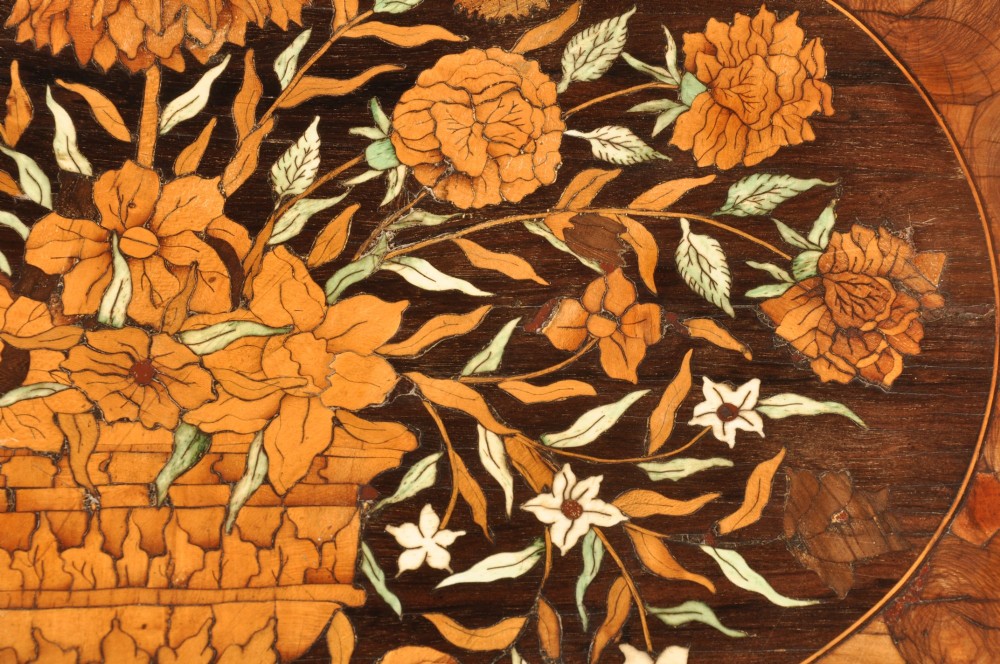 An antique brown walnut centre table featuring detailed floral marquetry inlays across the tabletop, single drawer front, and stretcher base, supported by bobbin-turned legs. View VIII
