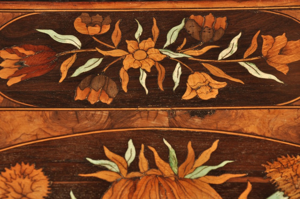 An antique brown walnut centre table featuring detailed floral marquetry inlays across the tabletop, single drawer front, and stretcher base, supported by bobbin-turned legs. View X