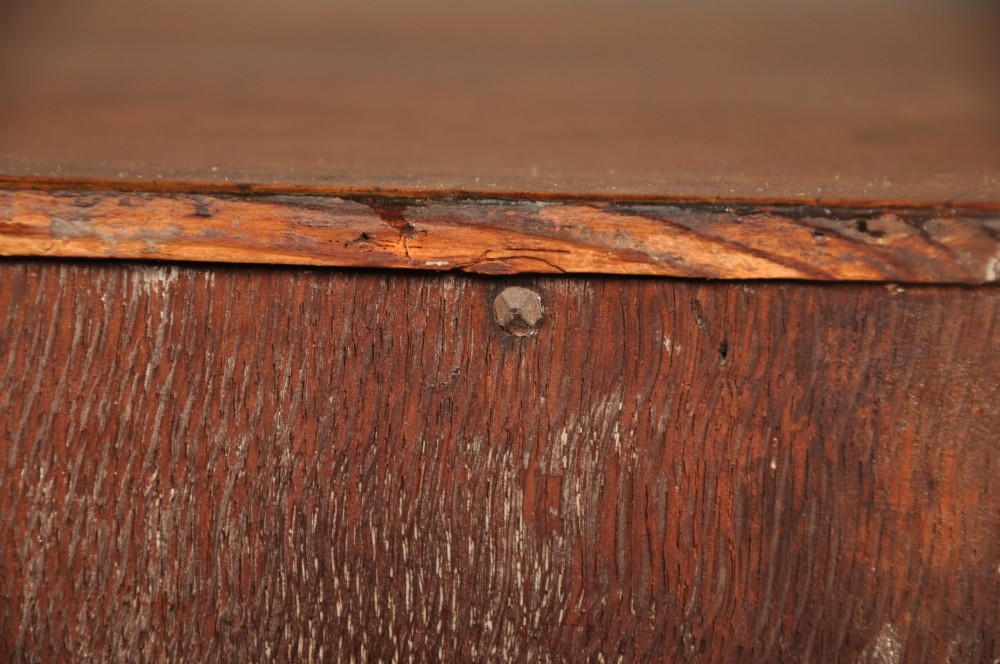 A Queen Anne walnut kneehole desk featuring figured wood veneers, seven drawers with brass handles, a central recessed cupboard, and bracket feet. View XV