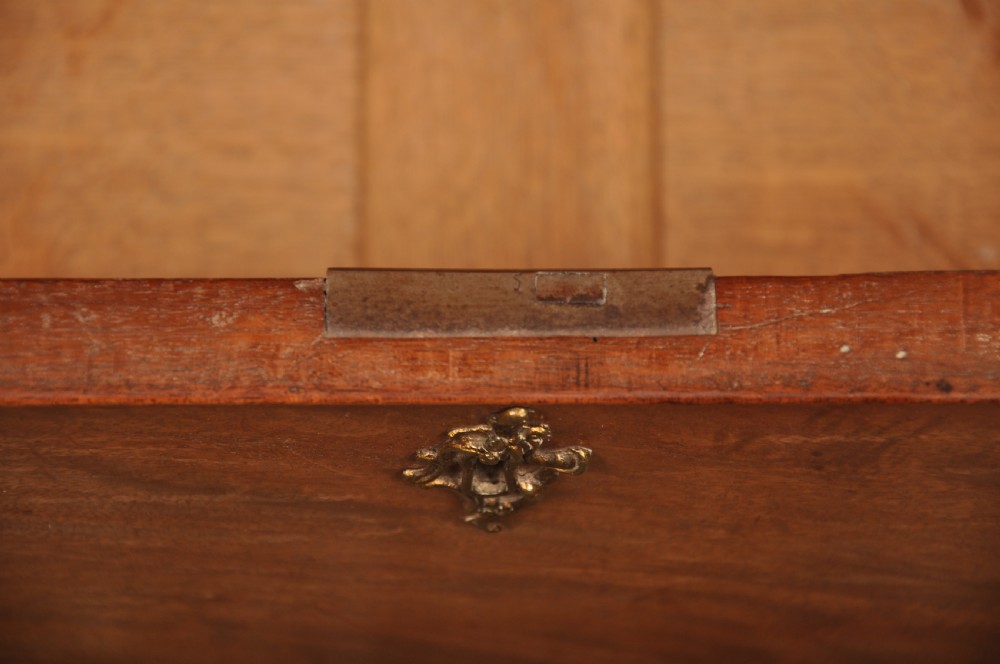 An 18th-century Georgian mahogany tallboy chest-on-chest with flame mahogany drawer fronts, brass swan-neck handles, fluted quarter columns, and bracket feet. View X