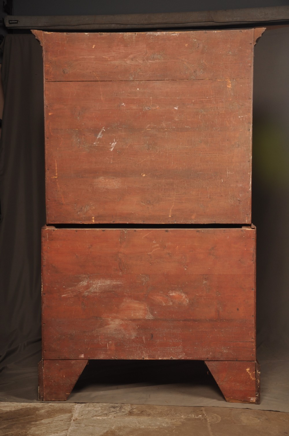 An 18th-century Georgian mahogany tallboy chest-on-chest with flame mahogany drawer fronts, brass swan-neck handles, fluted quarter columns, and bracket feet. View XI