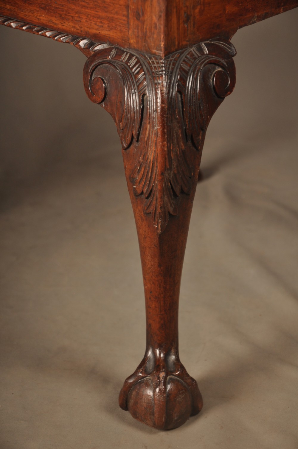 A pair of 18th-century George II mahogany side chairs featuring pierced carved splats, cabriole legs with claw and ball feet, and floral needlepoint drop-in seats. View VII