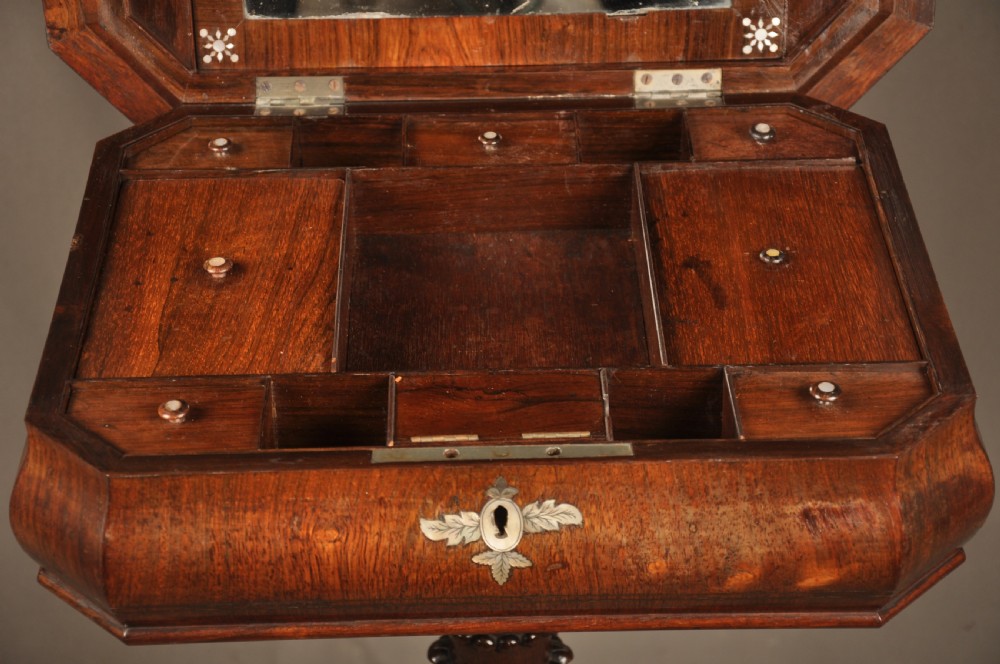 An antique octagonal mahogany work table with mother-of-pearl floral inlay, a central carved pedestal, and a quadruped base. View VI