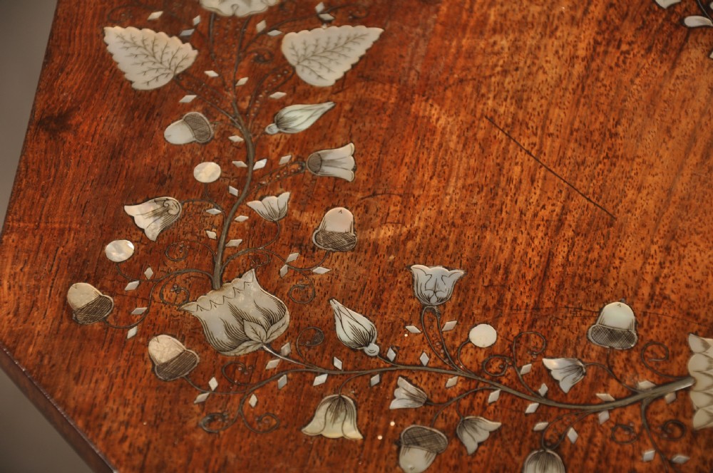 An antique octagonal mahogany work table with mother-of-pearl floral inlay, a central carved pedestal, and a quadruped base. View XI