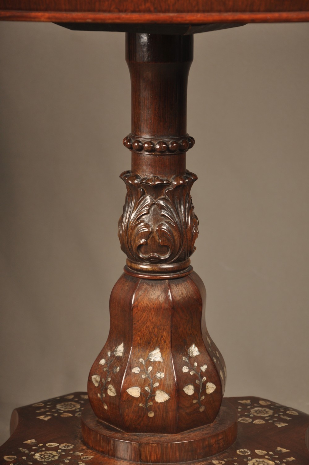 An antique octagonal mahogany work table with mother-of-pearl floral inlay, a central carved pedestal, and a quadruped base. View XII
