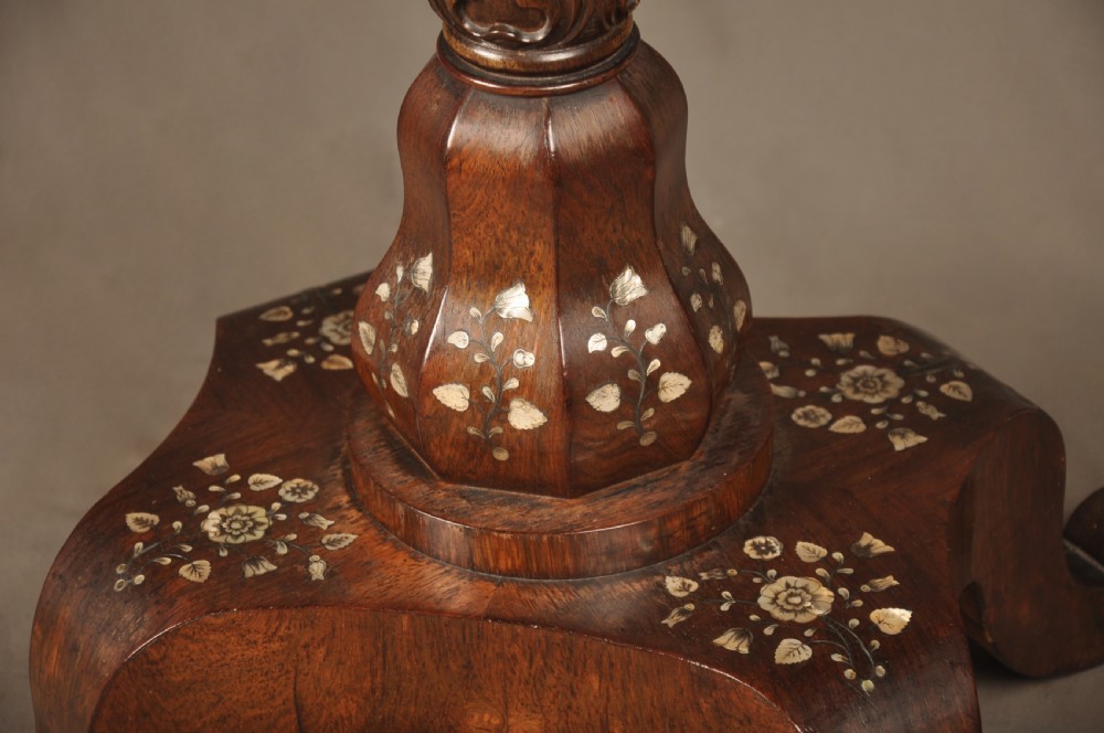 An antique octagonal mahogany work table with mother-of-pearl floral inlay, a central carved pedestal, and a quadruped base. View XIII
