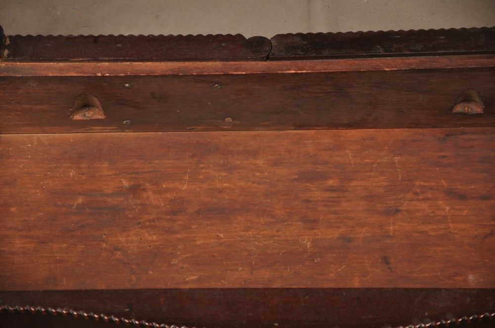 An 18th-century Georgian mahogany card table with a folded serpentine top and fluted legs. View XII