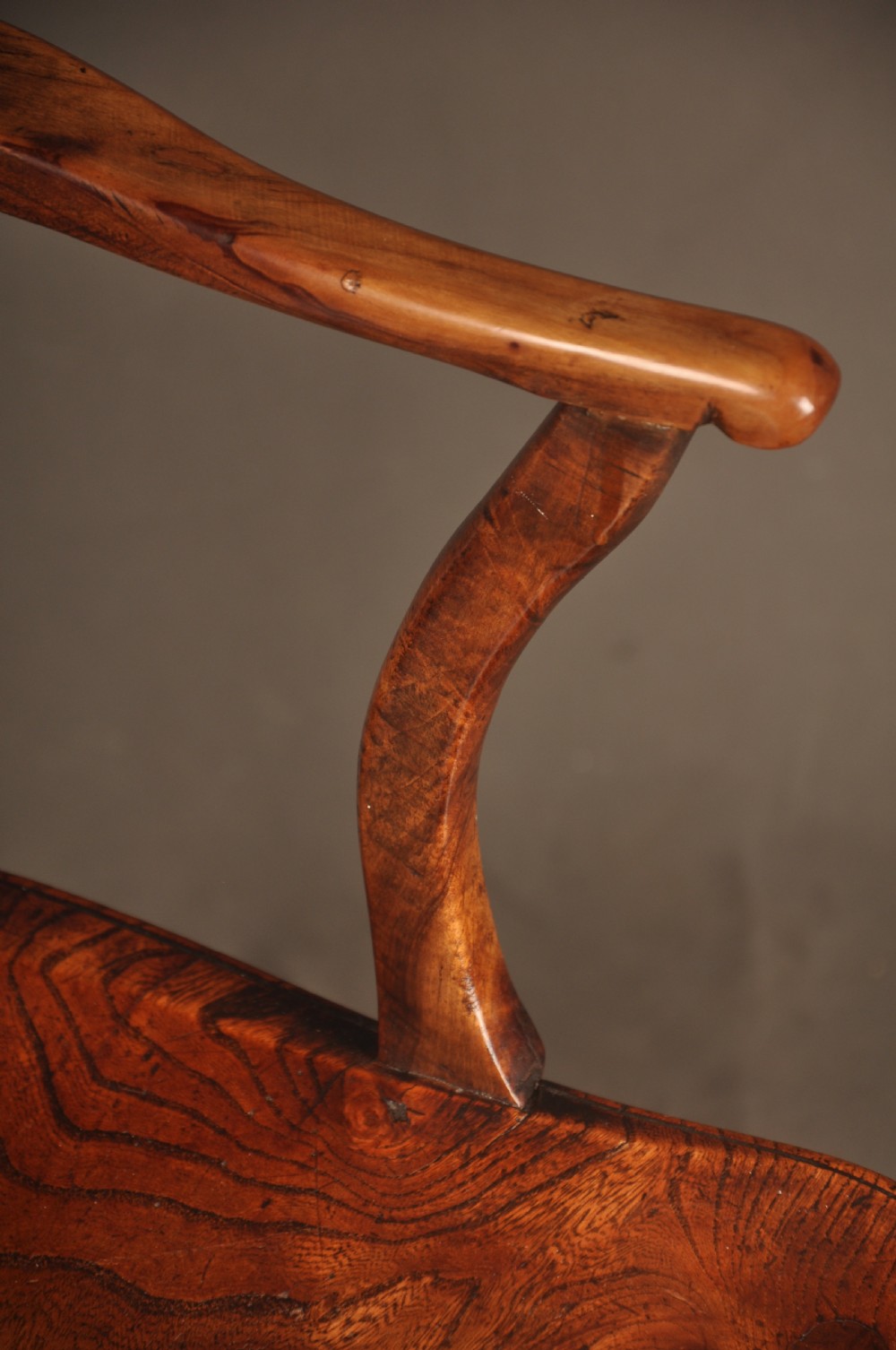 A pair of late 18th-century elm wheelback Windsor armchairs featuring curved backrests with pierced wheel splats, shaped seats, turned legs, and H-stretchers. View VIII