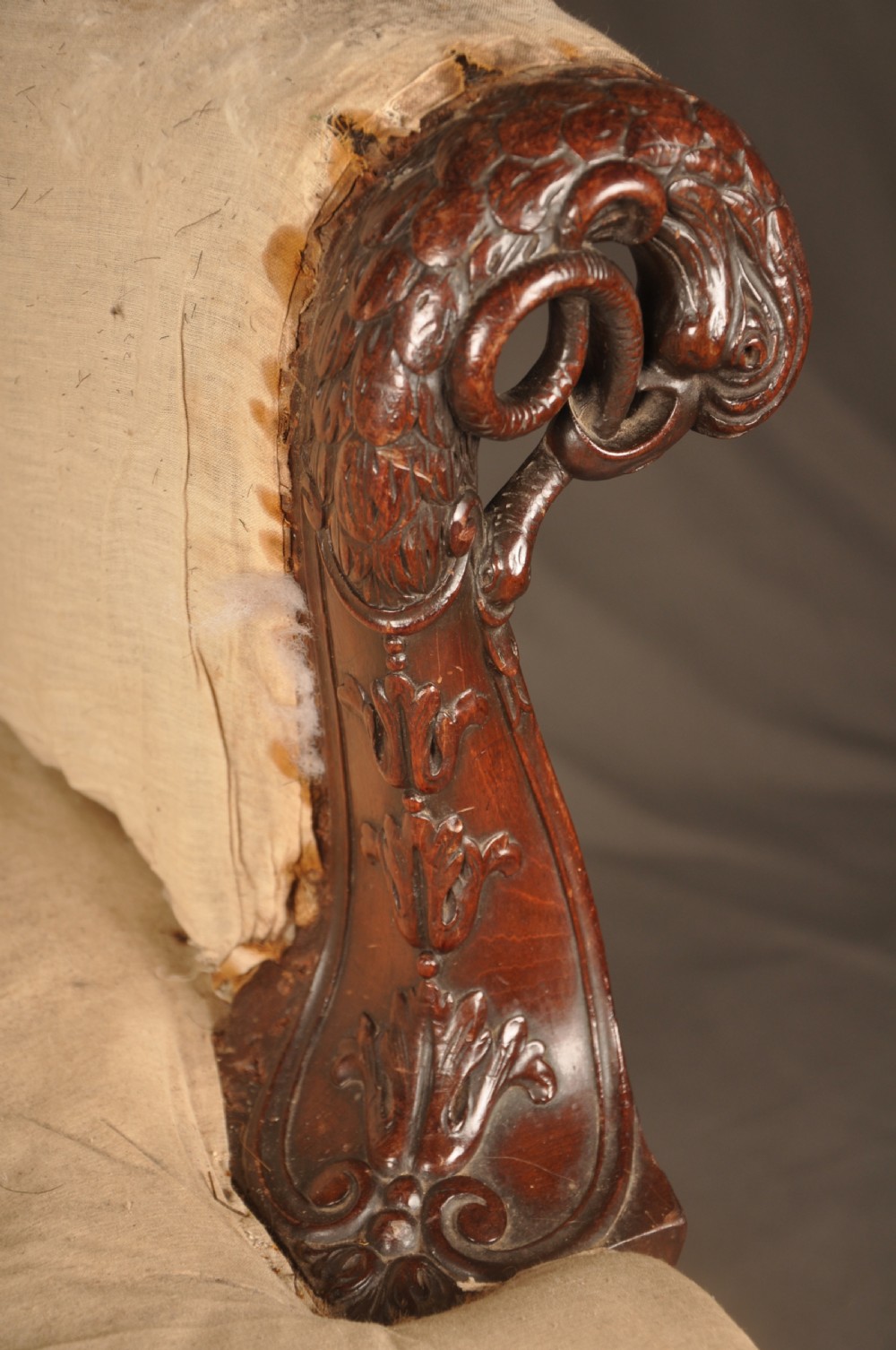 A 19th-century carved mahogany library armchair in calico lining, featuring cabriole legs with claw and ball feet and scrolled armrests. View III