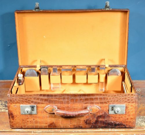 a fine crocodile leather vanity suitcase by adie bros birmingham with monogrammed 'ws' silver mounted jars a hip flask accessories 193638 - CATEGORY: ANTIQUE MISCELLANEOUS - DATED 1930