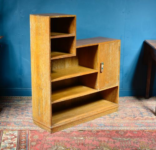 A LIMED OAK ASYMMETRICAL OPEN BOOKCASE ATTRIBUTED TO HEAL'S C1930 - ADDITIONAL PHOTO 2