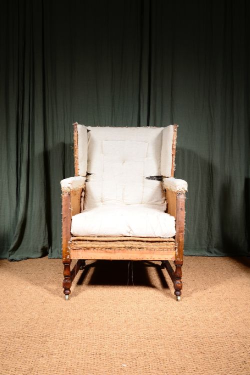 AN EDWARDIAN MAHOGANY ANGULAR WINGBACK ARMCHAIR STRIPPED FOR REUPHOLSTERY C1910 - ADDITIONAL PHOTO 2