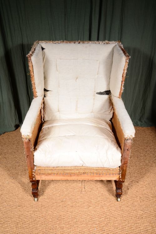 AN EDWARDIAN MAHOGANY ANGULAR WINGBACK ARMCHAIR STRIPPED FOR REUPHOLSTERY C1910 - ADDITIONAL PHOTO 3