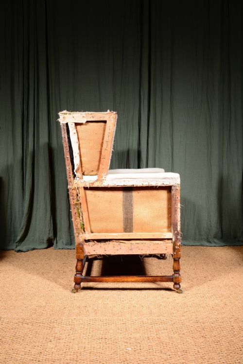 AN EDWARDIAN MAHOGANY ANGULAR WINGBACK ARMCHAIR STRIPPED FOR REUPHOLSTERY C1910 - ADDITIONAL PHOTO 4