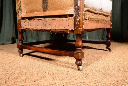 AN EDWARDIAN MAHOGANY ANGULAR WINGBACK ARMCHAIR STRIPPED FOR REUPHOLSTERY C1910 - ADDITIONAL PHOTO 6