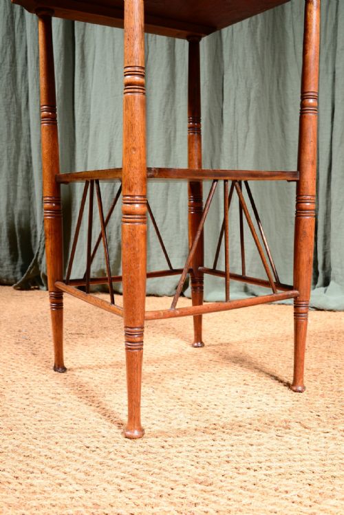 AN AESTHETIC MOVEMENT WALNUT TWO TIER TABLE TO A DESIGN BY EW GODWIN C1870 - ADDITIONAL PHOTO 1