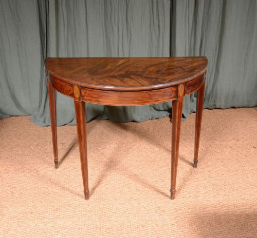 a georgian inlaid flame mahogany demi lune table c1820 - CATEGORY: ANTIQUE TABLES - DATED 19TH CENTURY