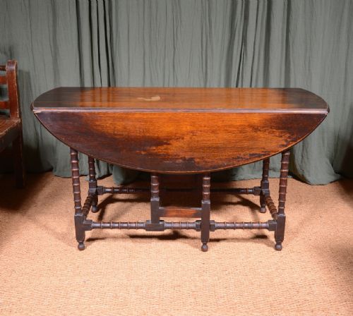an oak oval drop leaf dining table on bobbin legs c1890 - CATEGORY: ANTIQUE TABLES - DATED VICTORIAN