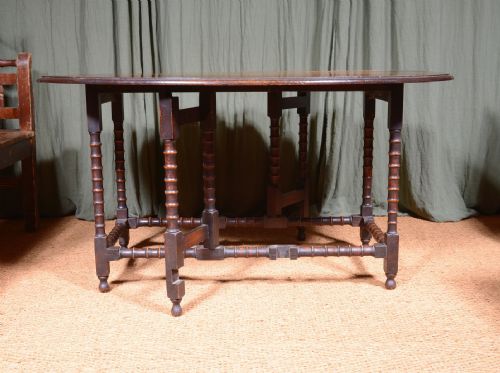 AN OAK OVAL DROP LEAF DINING TABLE ON BOBBIN LEGS C1890 - ADDITIONAL PHOTO 2