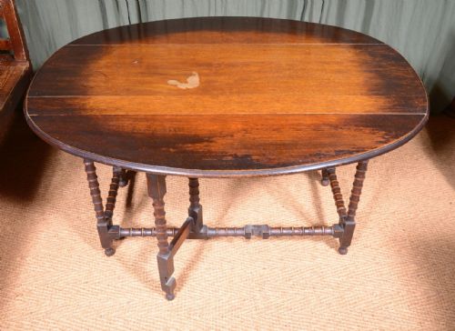 AN OAK OVAL DROP LEAF DINING TABLE ON BOBBIN LEGS C1890 - ADDITIONAL PHOTO 3