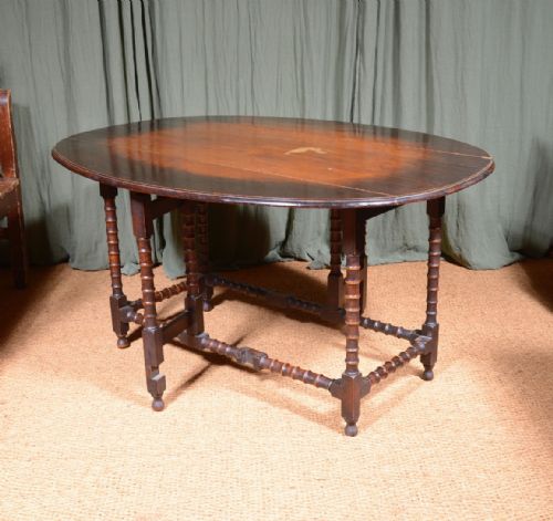 AN OAK OVAL DROP LEAF DINING TABLE ON BOBBIN LEGS C1890 - ADDITIONAL PHOTO 6