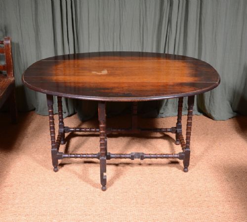 AN OAK OVAL DROP LEAF DINING TABLE ON BOBBIN LEGS C1890 - ADDITIONAL PHOTO 7