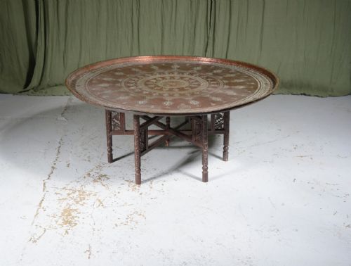 a large indian engraved brass and carved wood circular coffee table c1930 - CATEGORY: ANTIQUE TABLES - DATED 1930