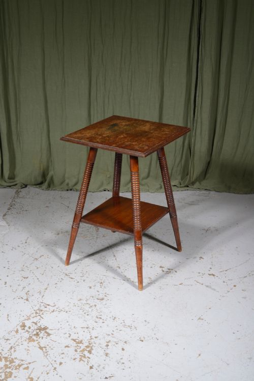 AN AESTHETIC MOVEMENT TWO TIER OAK TABLE ON RING TURNED SPLAY LEGS C1890 - ADDITIONAL PHOTO 1