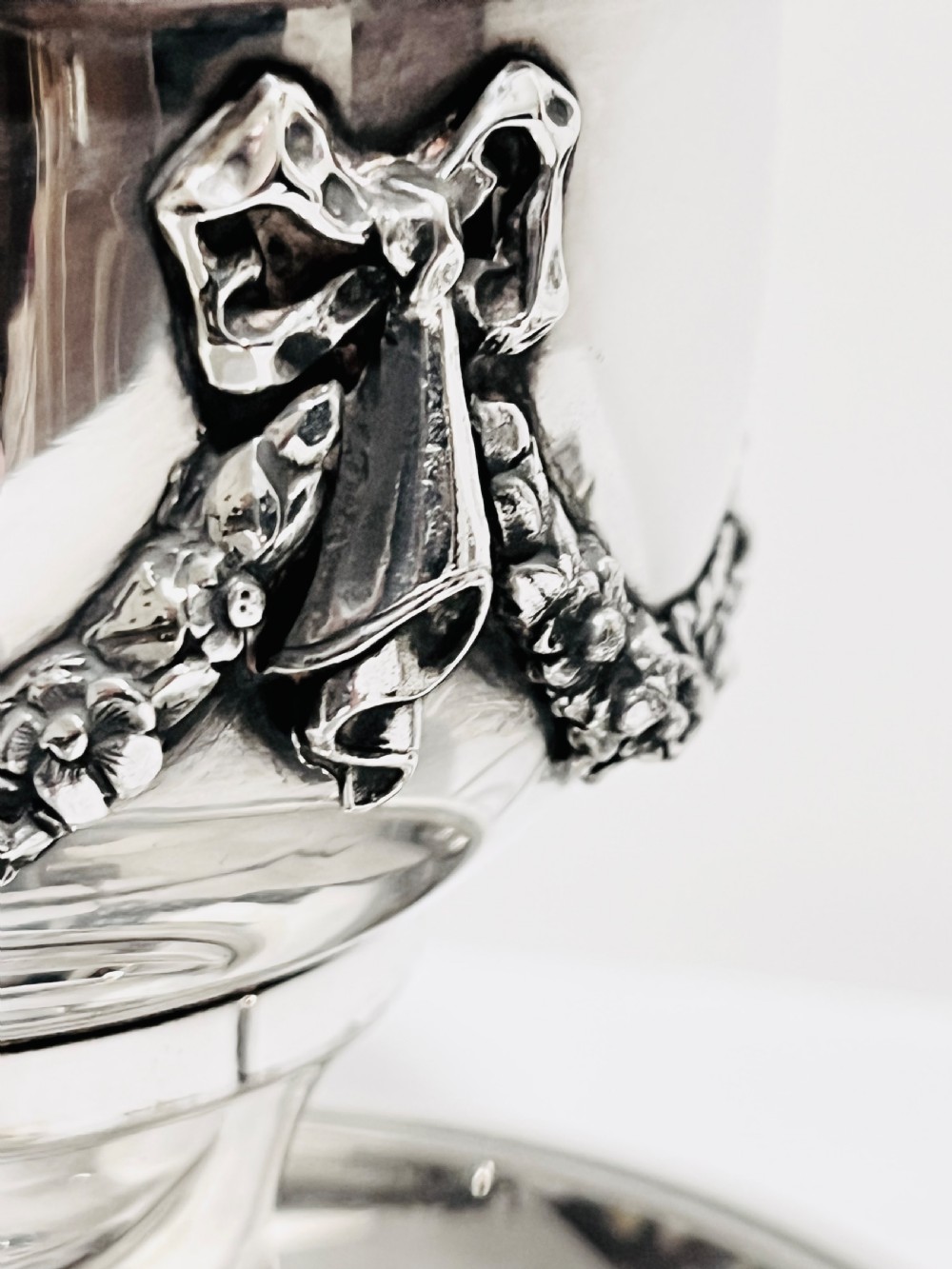 A late nineteenth-century German silver-plated chamberstick style table lamp with an etched frosted glass hurricane shade and a carved lion head motif. View II