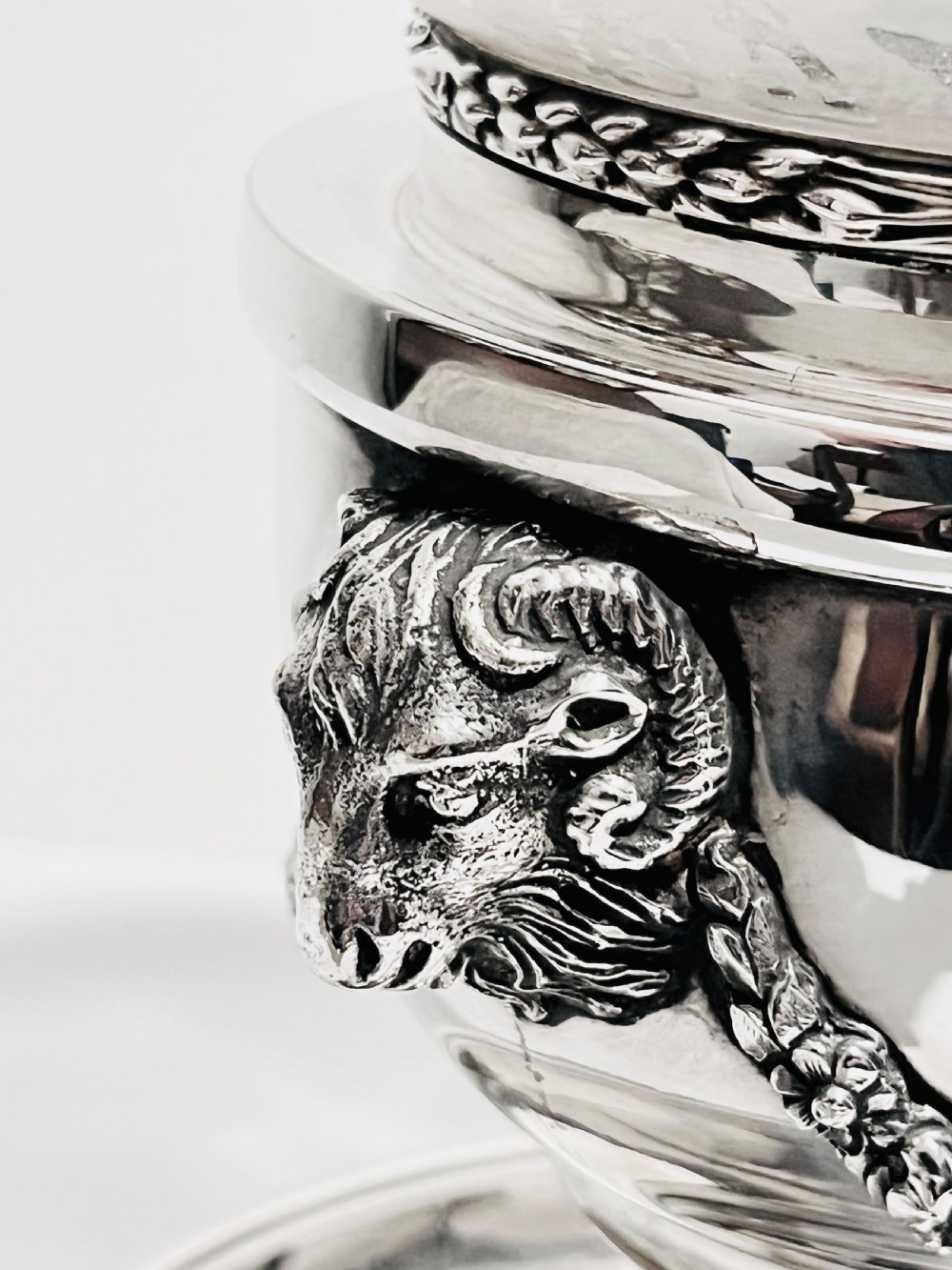 A late nineteenth-century German silver-plated chamberstick style table lamp with an etched frosted glass hurricane shade and a carved lion head motif. View III
