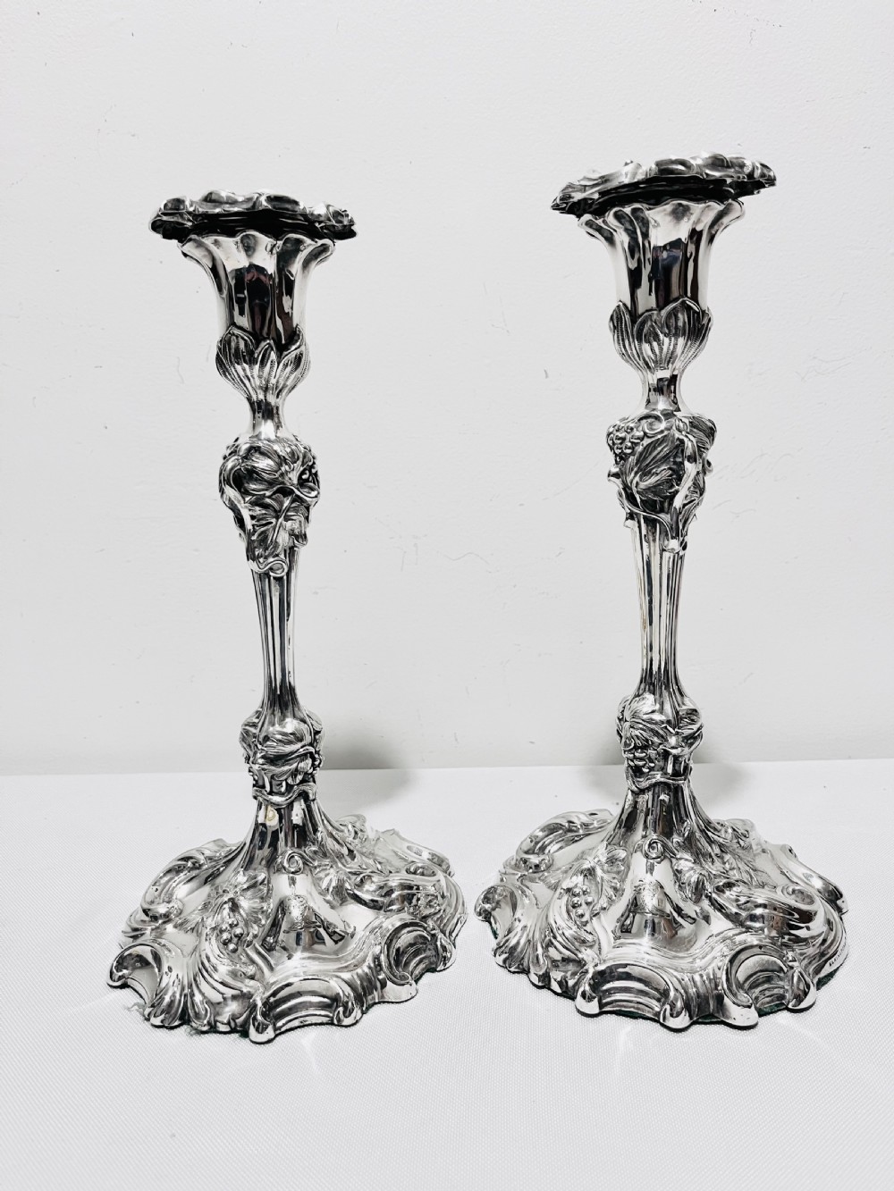 Pair of antique silver plated candlesticks by Elkington & Company