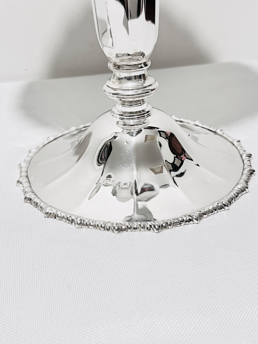 A pair of tall silver-plated trumpet vases featuring flared fluted rims, beaded border trims, and stepped circular bases. View II