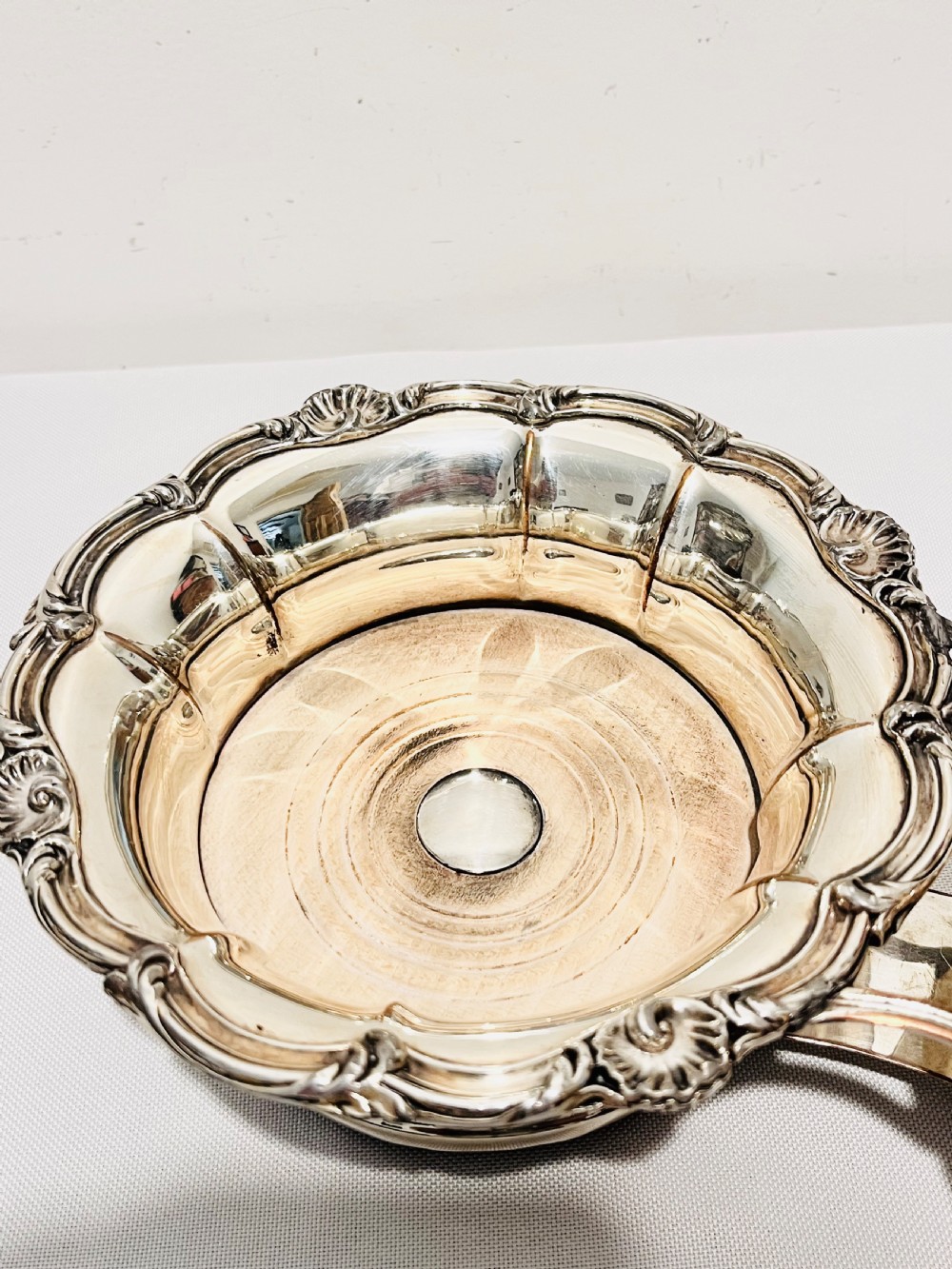 An antique Old Sheffield silver plate double wine decanter trolley with shell and scroll borders and turned wooden inserts. View VIII