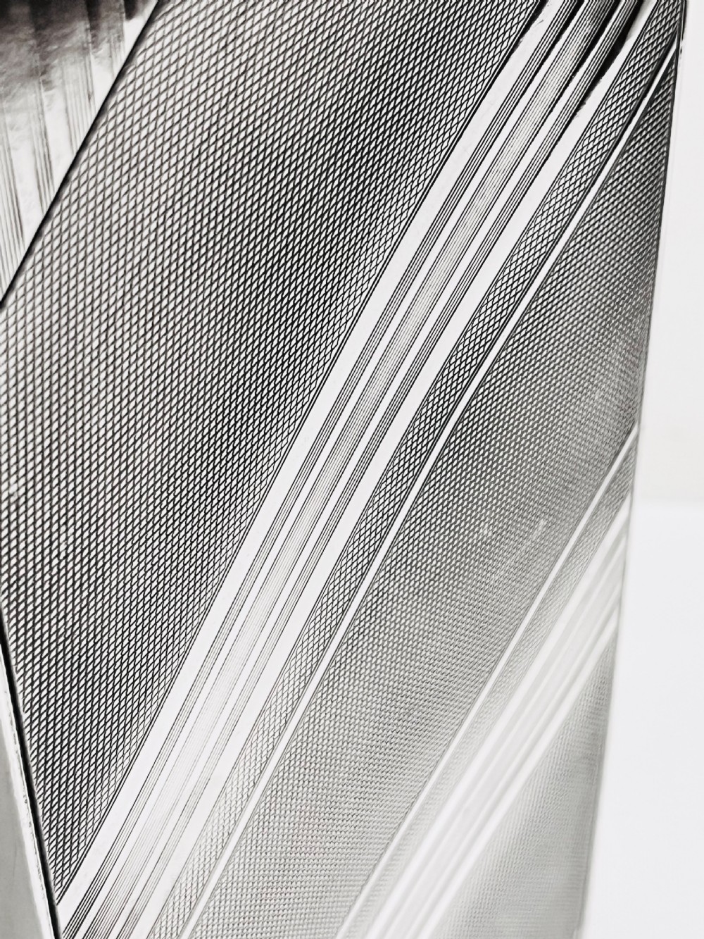 An Art Deco silver-plated giant spirit flask featuring geometric engine-turned pattern work and a cylindrical screw cap. View VI