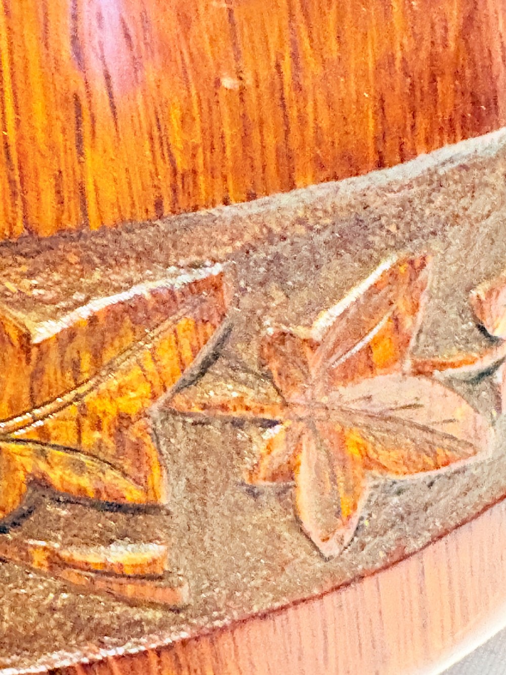 A late Victorian carved oak salad bowl with silver-plated rim, ball feet, and a white ceramic liner, featuring an ivy leaf carved band around the exterior. View IV