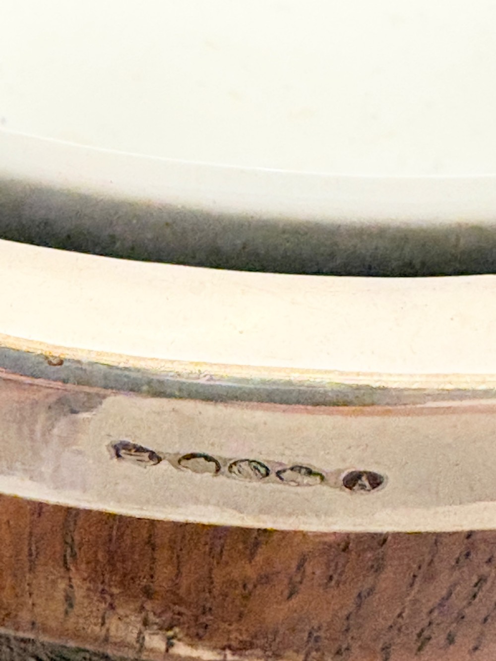 A late Victorian carved oak salad bowl with silver-plated rim, ball feet, and a white ceramic liner, featuring an ivy leaf carved band around the exterior. View VII