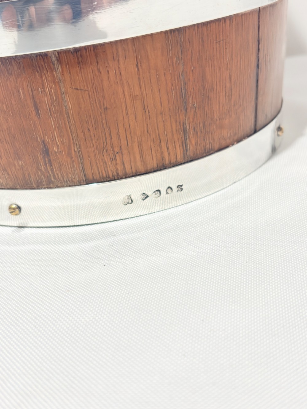 An antique coopered oak wine bucket featuring polished silver-plated bands, twin side handles, and a removable metal liner. View IX