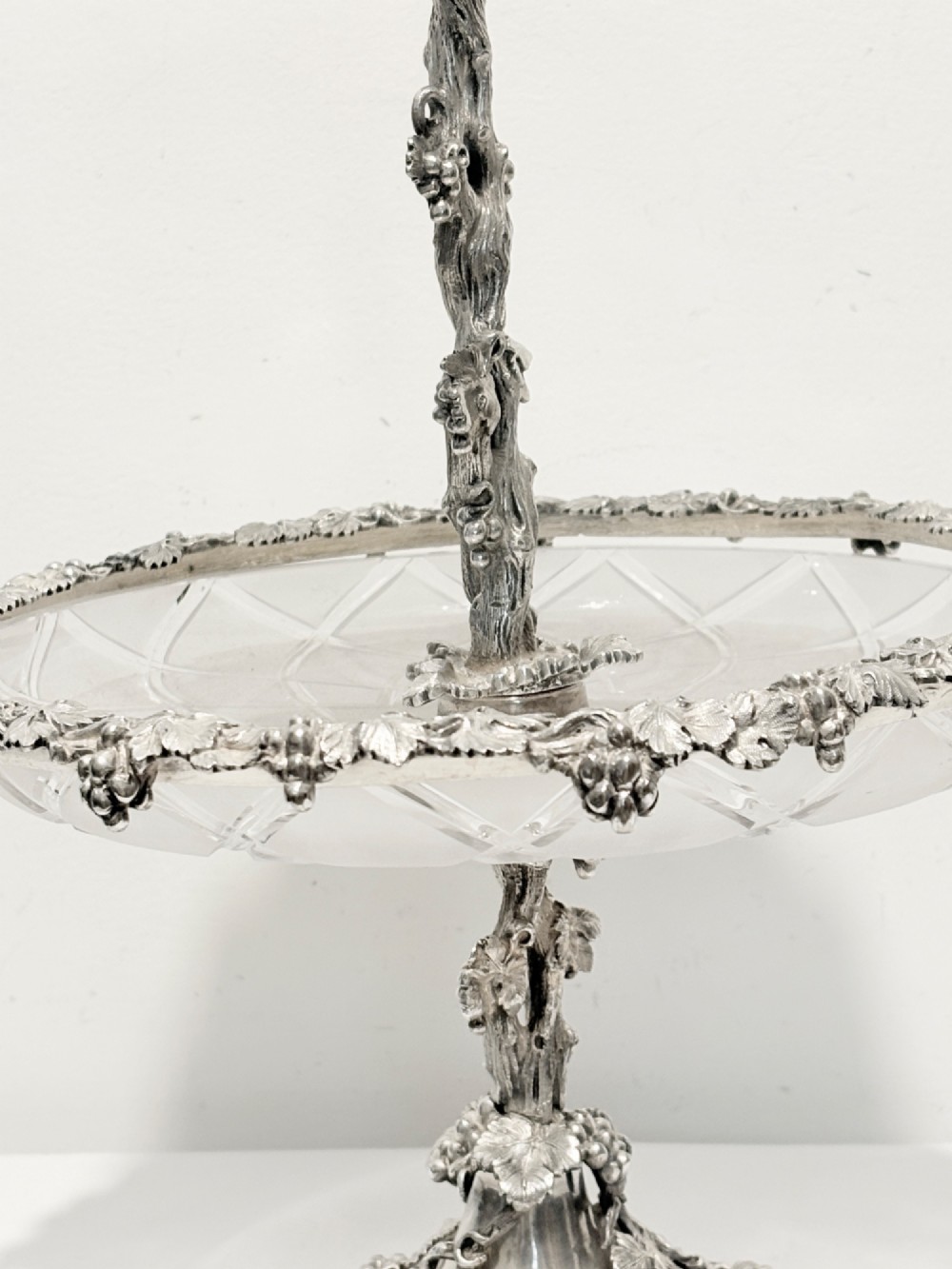 A Victorian silver-plated two-tiered epergne centerpiece featuring grapevine motifs and two cut glass trays. View III