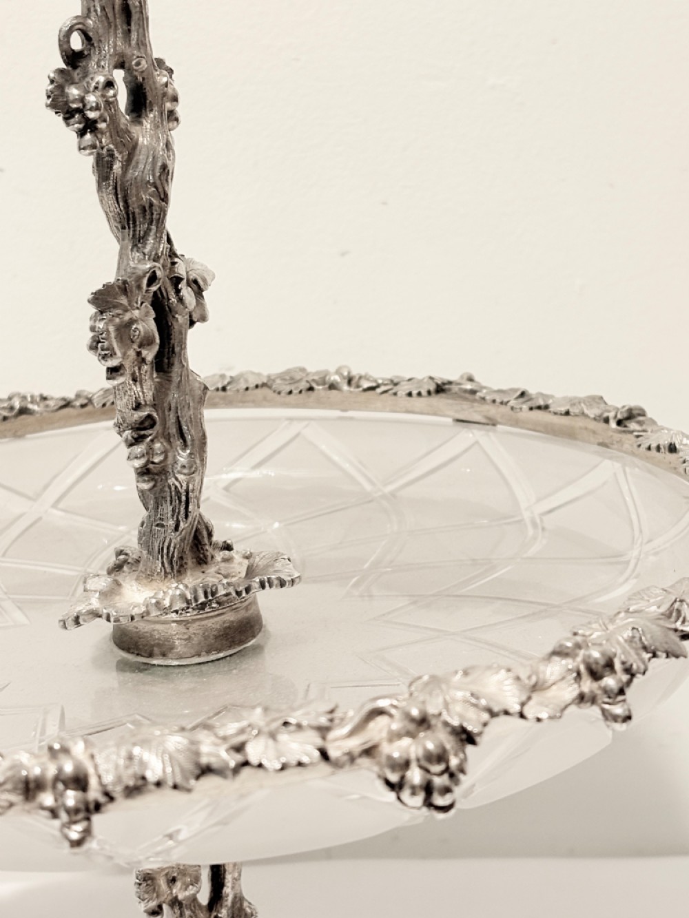 A Victorian silver-plated two-tiered epergne centerpiece featuring grapevine motifs and two cut glass trays. View VI