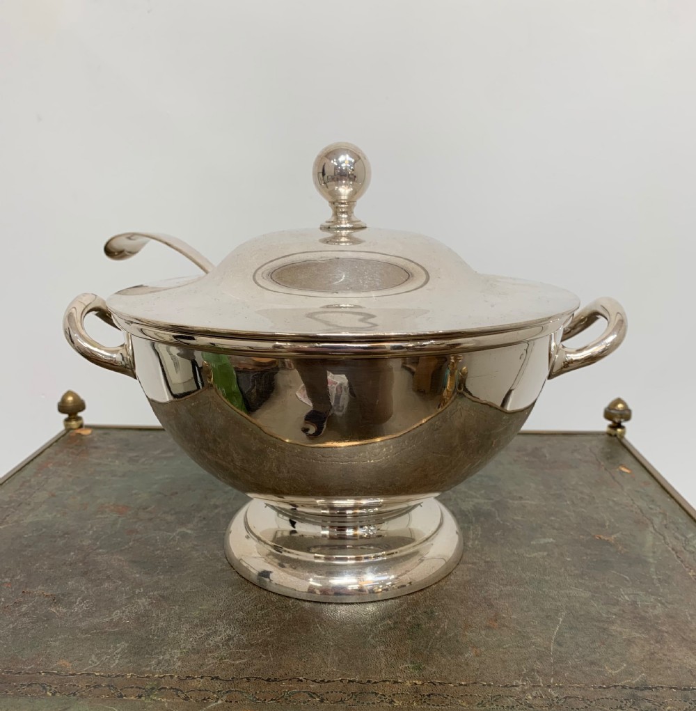 A Victorian silver-plated two-handled soup tureen featuring a domed lid, spherical finial, matching ladle, and pedestal base. View III