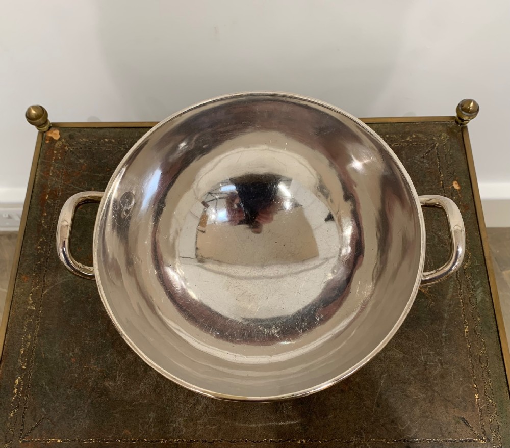 A Victorian silver-plated two-handled soup tureen featuring a domed lid, spherical finial, matching ladle, and pedestal base. View V